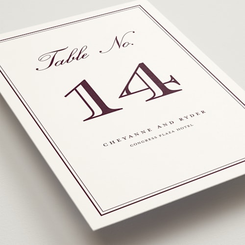 This is a burgundy table numbers with standard by Stacey Meacham called engraved names printing on doublethick in standard