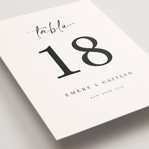 This is a ivory table numbers with standard by Adelyn T. called ink scribble printing on doublethick in standard