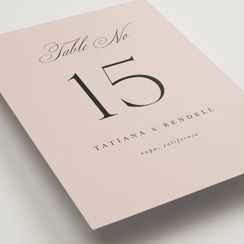 This is a dusty rose table numbers with standard by Kelly Schmidt called arch monogram printing on doublethick in standard