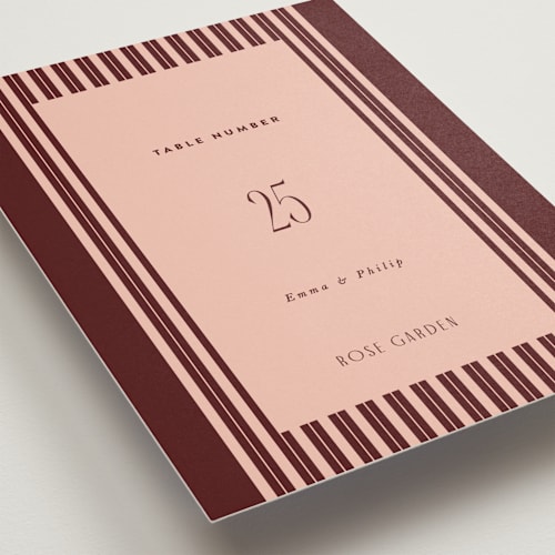 This is a burgundy table numbers with standard by Nazia Hyder called museum printing on doublethick in standard
