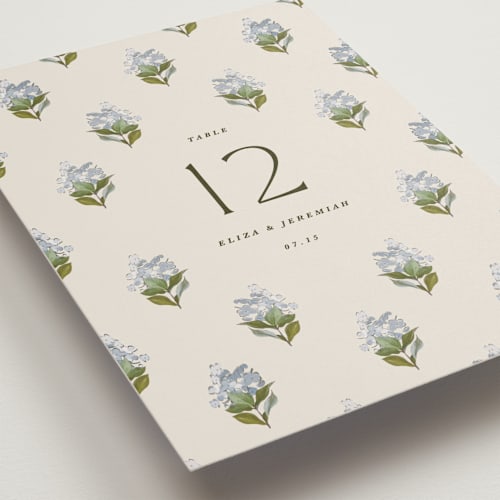 This is a almond table numbers with standard by Olivia Kanaley Inman called blockprint printing on doublethick in standard