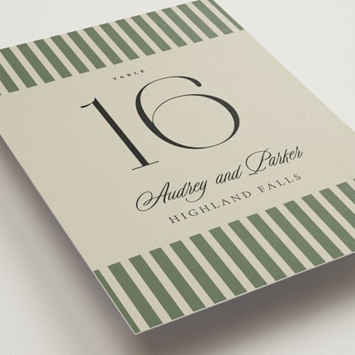 This is a ruby table numbers with standard by Jackie Crawford called holiday ribbon printing on doublethick in standard