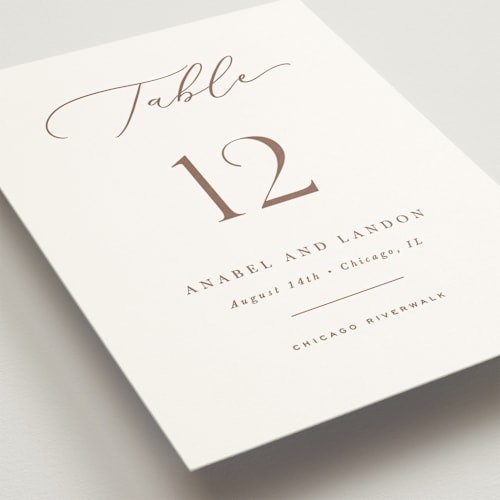 This is a pearl table numbers with standard by Hooray Creative called luxe script printing on doublethick in standard