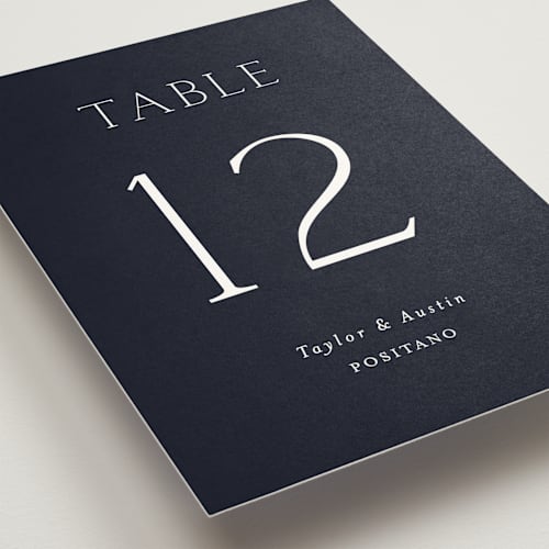 This is a navy table numbers with standard by Vanessa Doyle called in love printing on doublethick in standard
