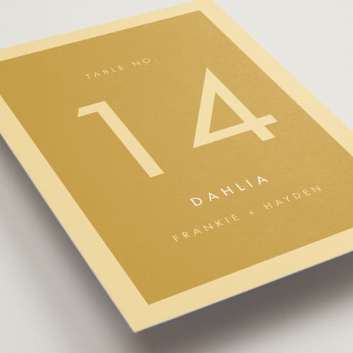 This is a buttercup table numbers with standard by Snow and Ivy called colorfield printing on doublethick in standard