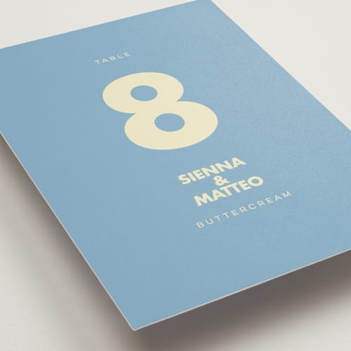 This is a skyblue table numbers with standard by Ellen Schlegelmilch called sienna printing on doublethick in standard