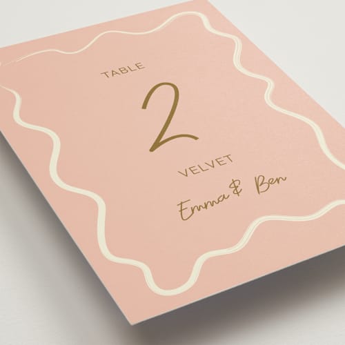 This is a butterscotch table numbers with standard by Helena Vitto called handwritten letter printing on doublethick in standard