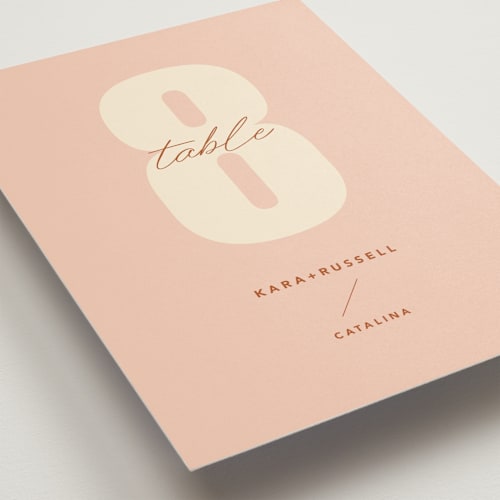 This is a blush table numbers with standard by Stacey Day called typographical poster printing on doublethick in standard