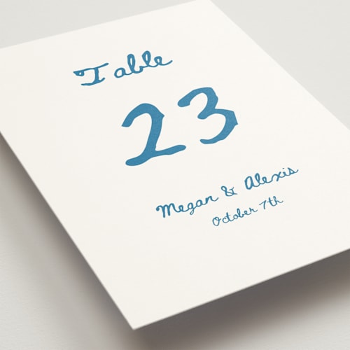 This is a aqua table numbers with standard by Cass Loh called simple monogram printing on doublethick in standard