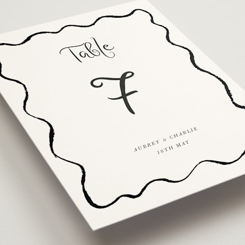This is a tuxedo table numbers with standard by Cass Loh called quirky fun printing on doublethick in standard