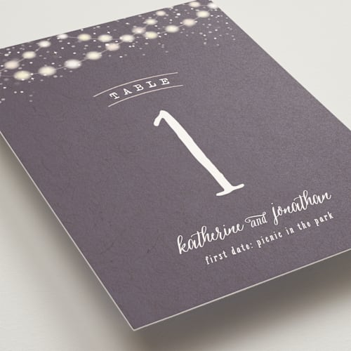 This is a plum table numbers with standard by Hooray Creative called garden lights printing on doublethick in standard