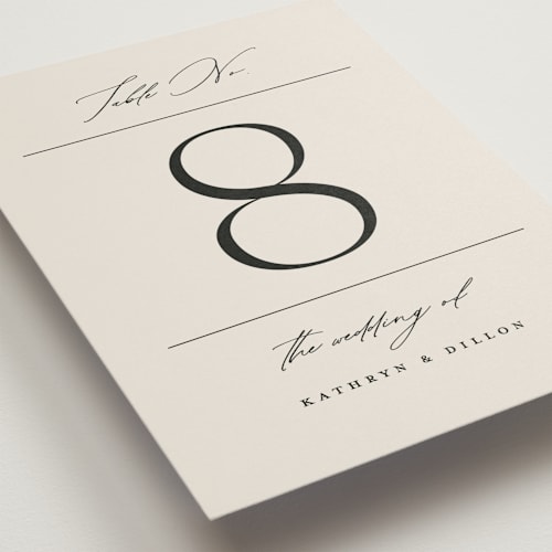 This is a ecru table numbers with standard by Erica Krystek called modern monogram printing on doublethick in standard