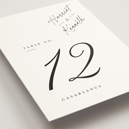 This is a linen table numbers with standard by Ana de Sousa called scripted elegance printing on doublethick in standard