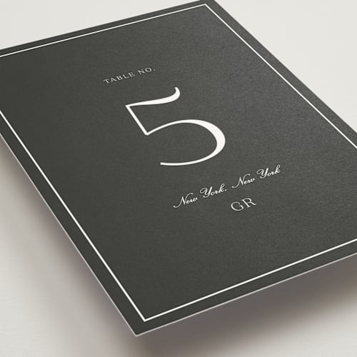 This is a charcoal table numbers with standard by Megan Davis called upper east printing on doublethick in standard