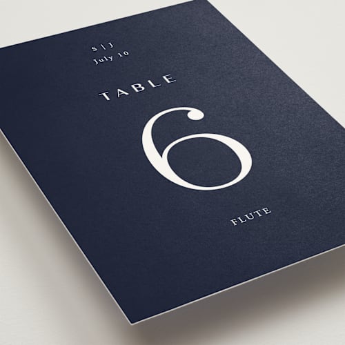 This is a navy table numbers with standard by Annie Shapiro called arguello printing on doublethick in standard