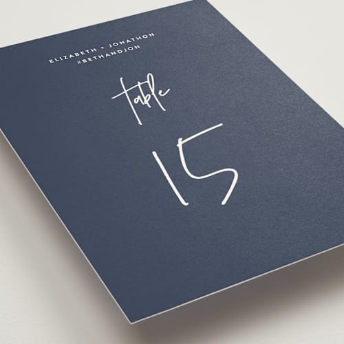 This is a navy table numbers with standard by JoAnn Jinks called marked printing on doublethick in standard