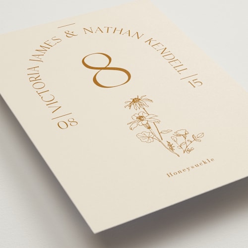 This is a cream table numbers with standard by Baumbirdy called floral type arch printing on signature in standard