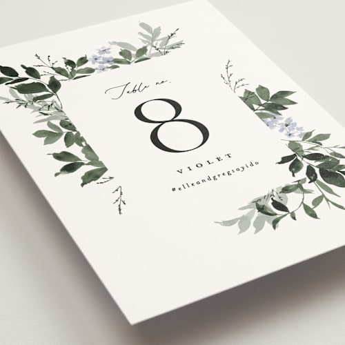 This is a cornflower table numbers with standard by Everett Paper Goods called grove printing on signature in standard