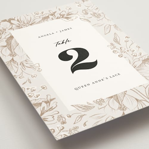This is a cream table numbers with standard by Paper Raven Co. called sketched flora printing on doublethick in standard