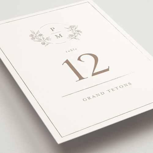 This is a taupe table numbers with standard by Chris Griffith called monogrammed printing on doublethick in standard
