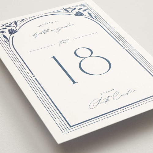 This is a delphinium table numbers with standard by Ashley DeMeyere called nouveau frame printing on doublethick in standard