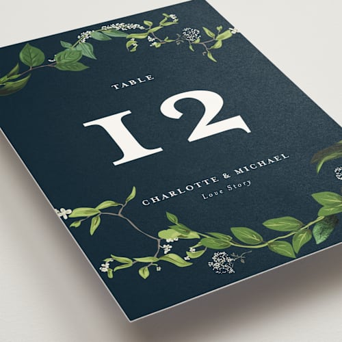 This is a navy table numbers with standard by Susan Moyal called greenery printing on doublethick in standard