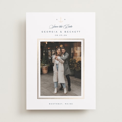 This is a royal navy foil stamped save the date cards with foil pressed by Olivia Raufman called anchored printing on recycled smooth signature in standard