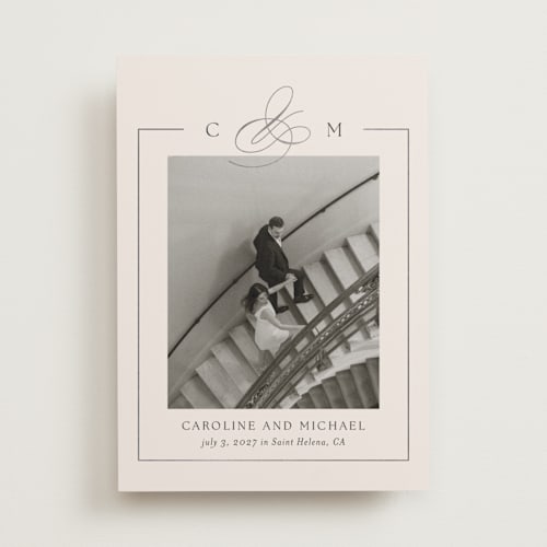 This is a linen foil stamped save the date cards with foil pressed by Kelly Schmidt called framed monogram printing on recycled smooth signature in standard
