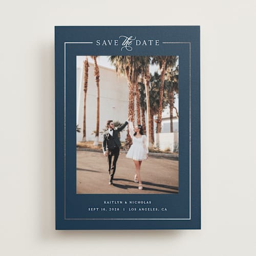 This is a navy foil stamped save the date cards with foil pressed by Melanie Kosuge called mulholland printing on recycled smooth signature in standard