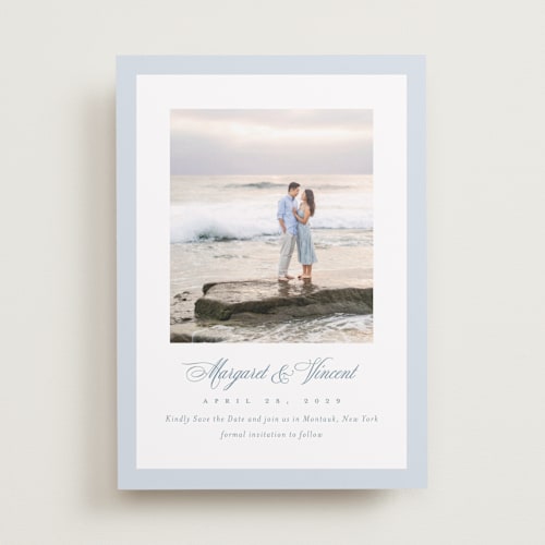 This is a dusty blue save the date with standard by Jennifer Postorino called coastal charm printing on recycled smooth signature in standard