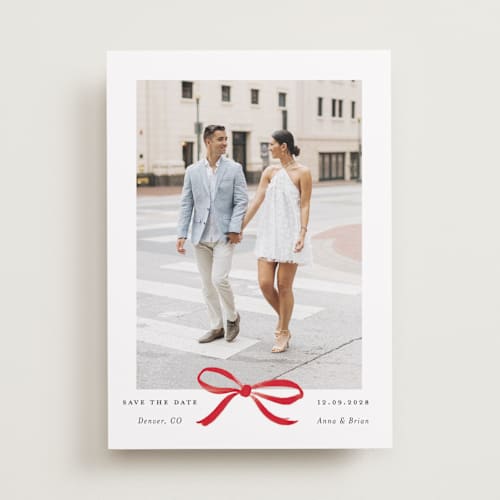 This is a crimson save the date with standard by Olivia Kanaley Inman called crimson bow printing on recycled smooth signature in standard