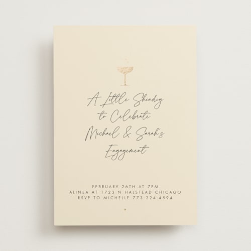 This is a champagne engagement party invitations with foil pressed by mo kelley called a little shindig printing on signature in standard