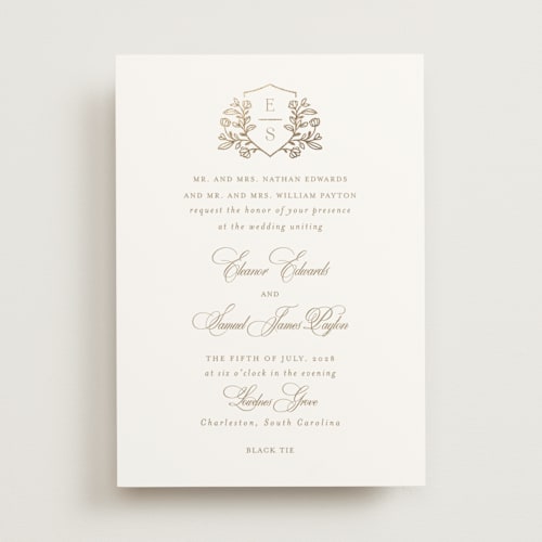 This is a ivory foil stamped wedding invitations with foil pressed by Mansi Verma called gold crest printing on signature in standard