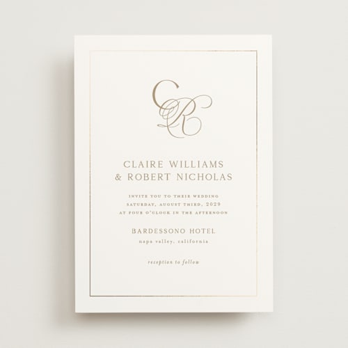 This is a golden foil stamped wedding invitations with foil pressed by Kelly Schmidt called monogram script printing on signature in standard