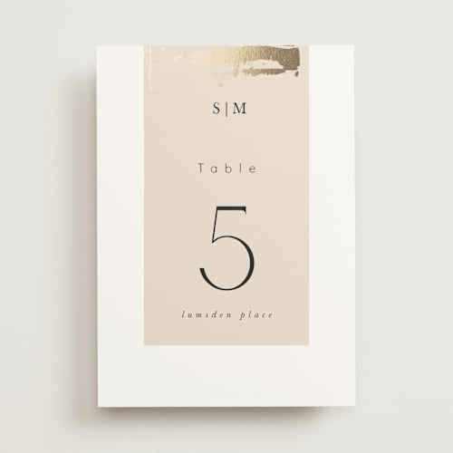 This is a blush table numbers with foil pressed by Hannah Williams called modern serene printing on doublethick in standard