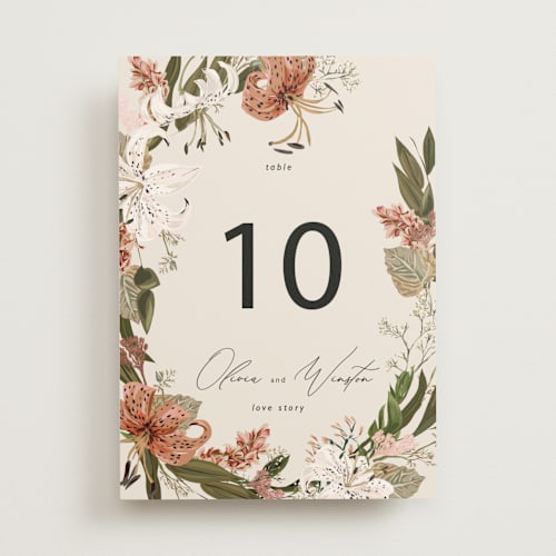 This is a terracotta table numbers with foil pressed by Susan Moyal called delicate printing on doublethick in standard