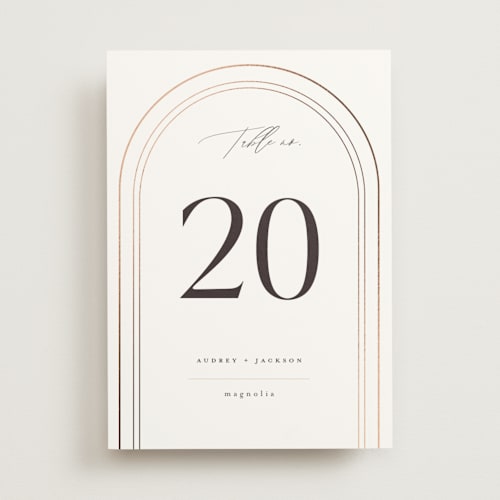 This is a marshmallow table numbers with foil pressed by Vera Lim called the arc printing on doublethick in standard