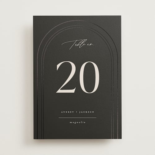 This is a truffle table numbers with foil pressed by Vera Lim called the arc printing on doublethick in standard
