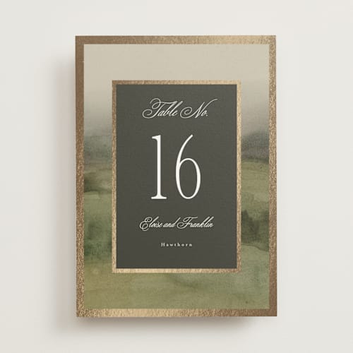 This is a graphite table numbers with foil pressed by Everett Paper Goods called hillside printing on doublethick in standard