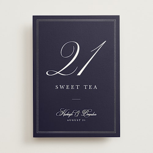This is a navy table numbers with foil pressed by Sarah Brown called traditionalist printing on doublethick in standard