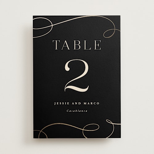 This is a onyx table numbers with foil pressed by Hooray Creative called black tie affair printing on doublethick in standard