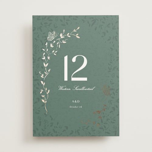 This is a eucalyptus table numbers with foil pressed by Simona Camp called southern romance printing on doublethick in standard