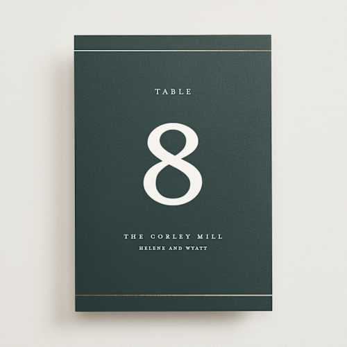 This is a forest table numbers with foil pressed by Stacey Meacham called style and grace printing on doublethick in standard