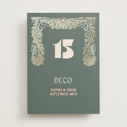 This is a sage table numbers with foil pressed by GeekInk Design called nouveau frame printing on doublethick in standard
