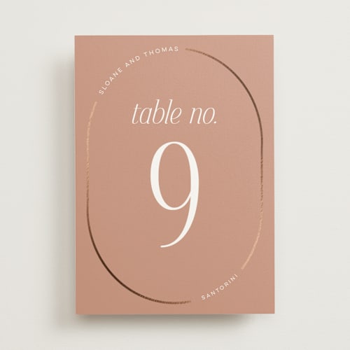 This is a clay table numbers with foil pressed by Morgan Kendall called unity printing on doublethick in standard