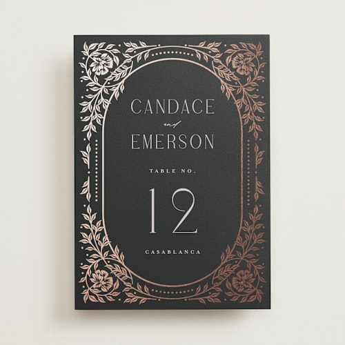 This is a onyx table numbers with foil pressed by Ana de Sousa called gilded nouveau frame printing on doublethick in standard