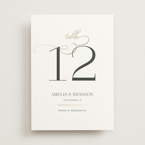 This is a sugar table numbers with foil pressed by Jessica Williams called elegant flourish printing on doublethick in standard