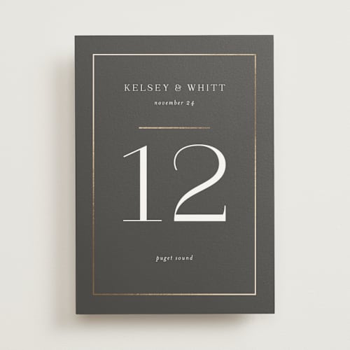 This is a stormy table numbers with foil pressed by Jessica Williams called over monogram printing on doublethick in standard