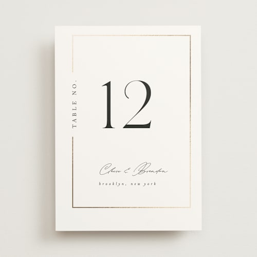 This is a silk table numbers with foil pressed by Kelly Schmidt called gilded border printing on doublethick in standard