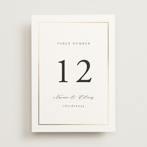 This is a pearl table numbers with foil pressed by Nicole Walsh called gilded frame printing on doublethick in standard